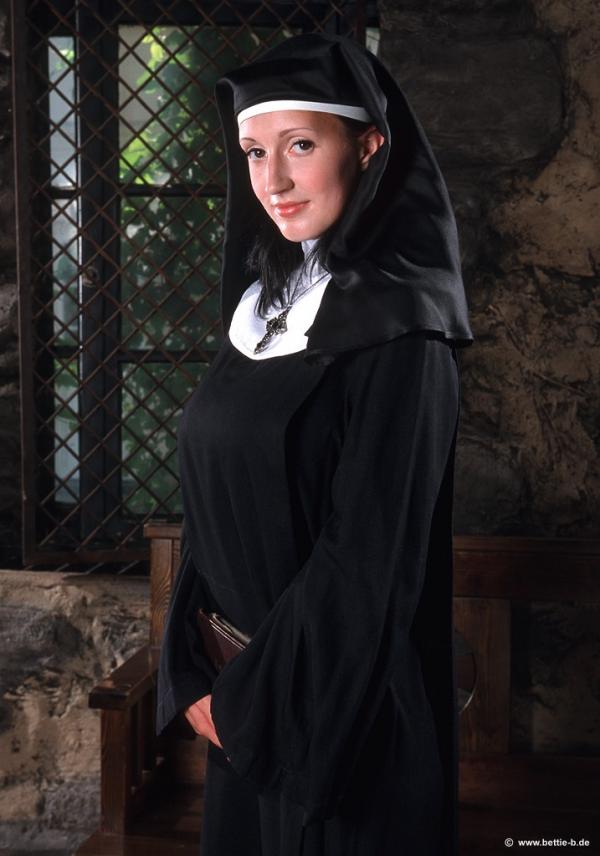 Annemarie Dressed As A Nun With Huge Breasts Stripping Off Her Habit